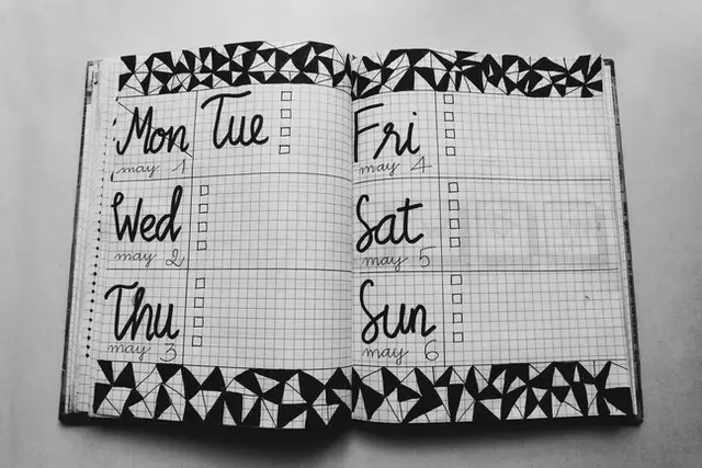 a calendar book showing the days of the week
