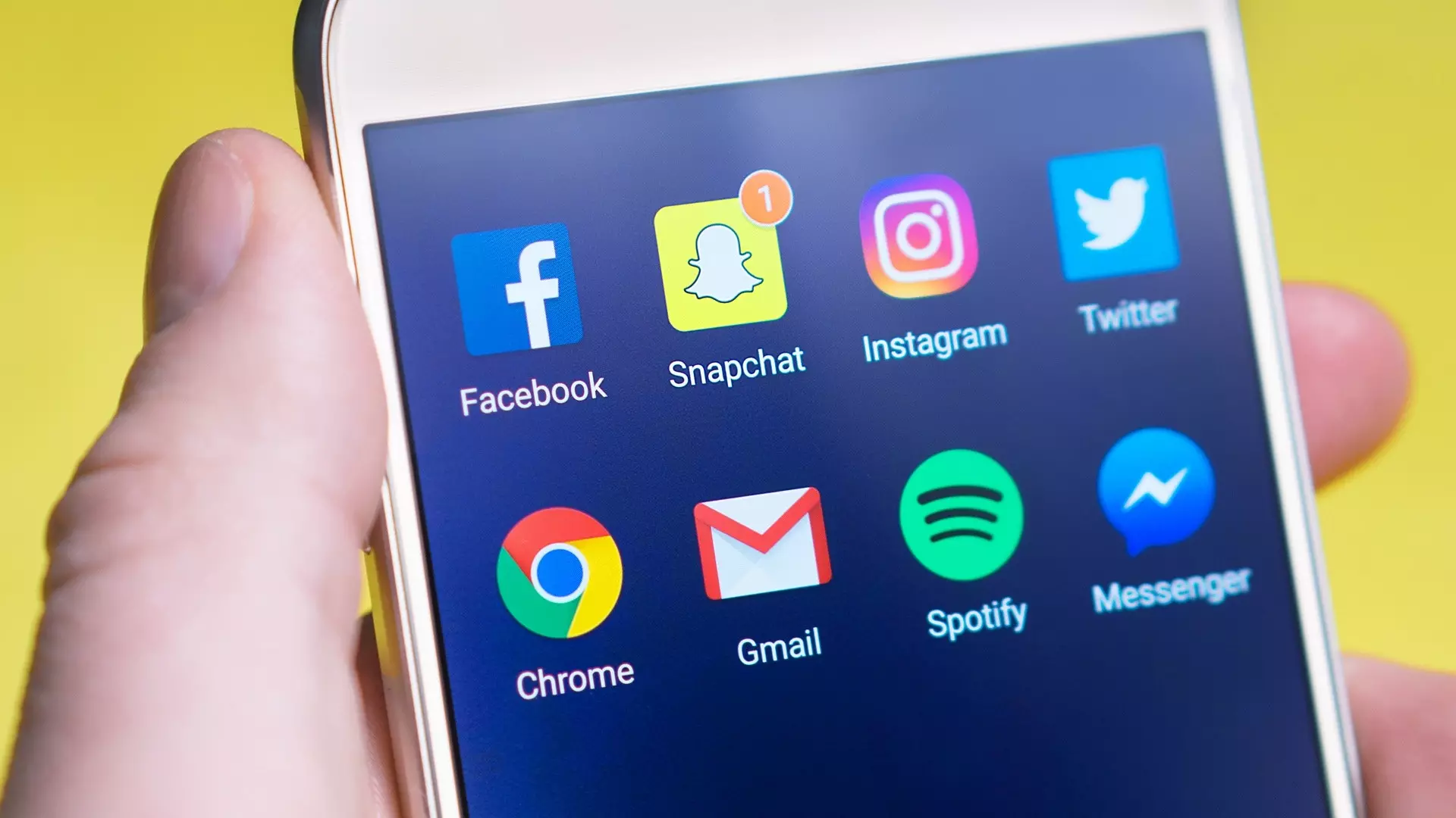 a smartphone with social media icons showing
