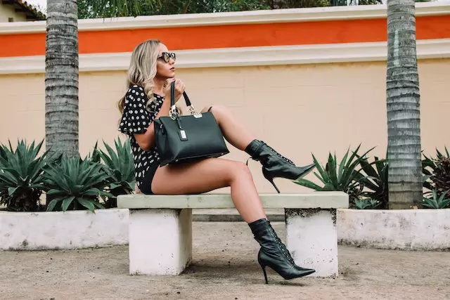 an influencer model posing on a bench
